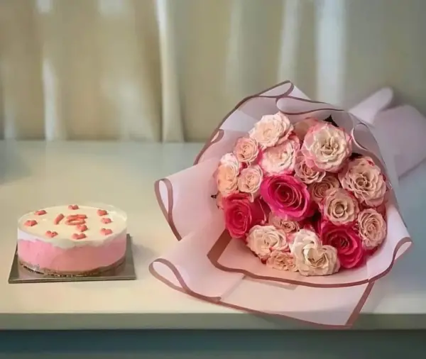 Elegant White and Pink Cake with Flower Bouquet