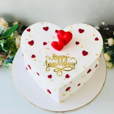 Elegant White Heart-Shaped Love Cake for Special Occasions