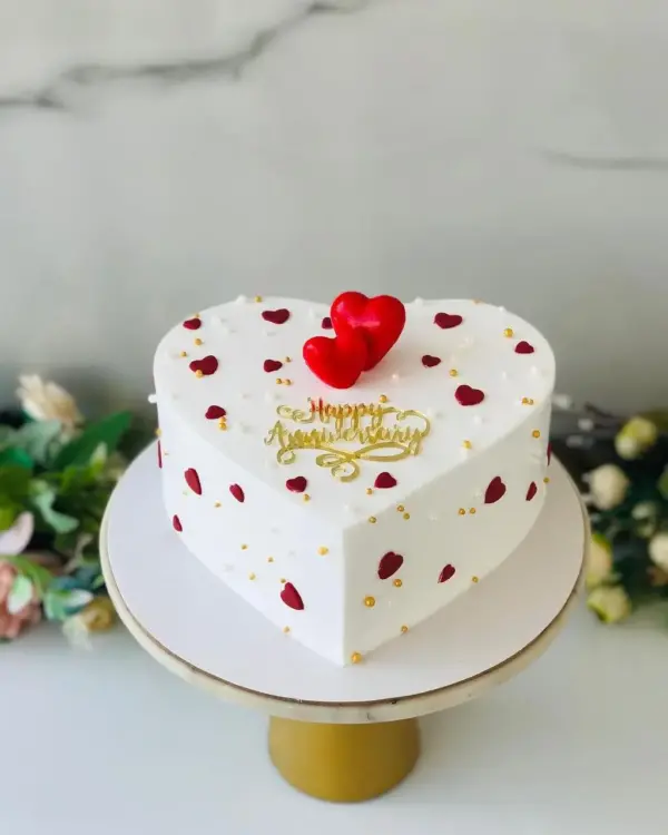 Elegant White Heart-Shaped Love Cake for Special Occasions