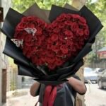 Heart-Shaped Red Rose Bouquet with Black Wrap