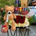 Teddy Bear & Chocolate Flower Gift Arrangement