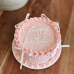 Blush Ribbon Birthday Cake – 1KG Premium Pink Cream Cake