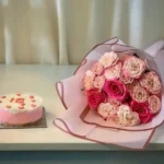 Elegant White and Pink Cake with Flower Bouquet