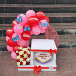 A Promise Wrapped in Love – Roses, Cake & Balloon Arch