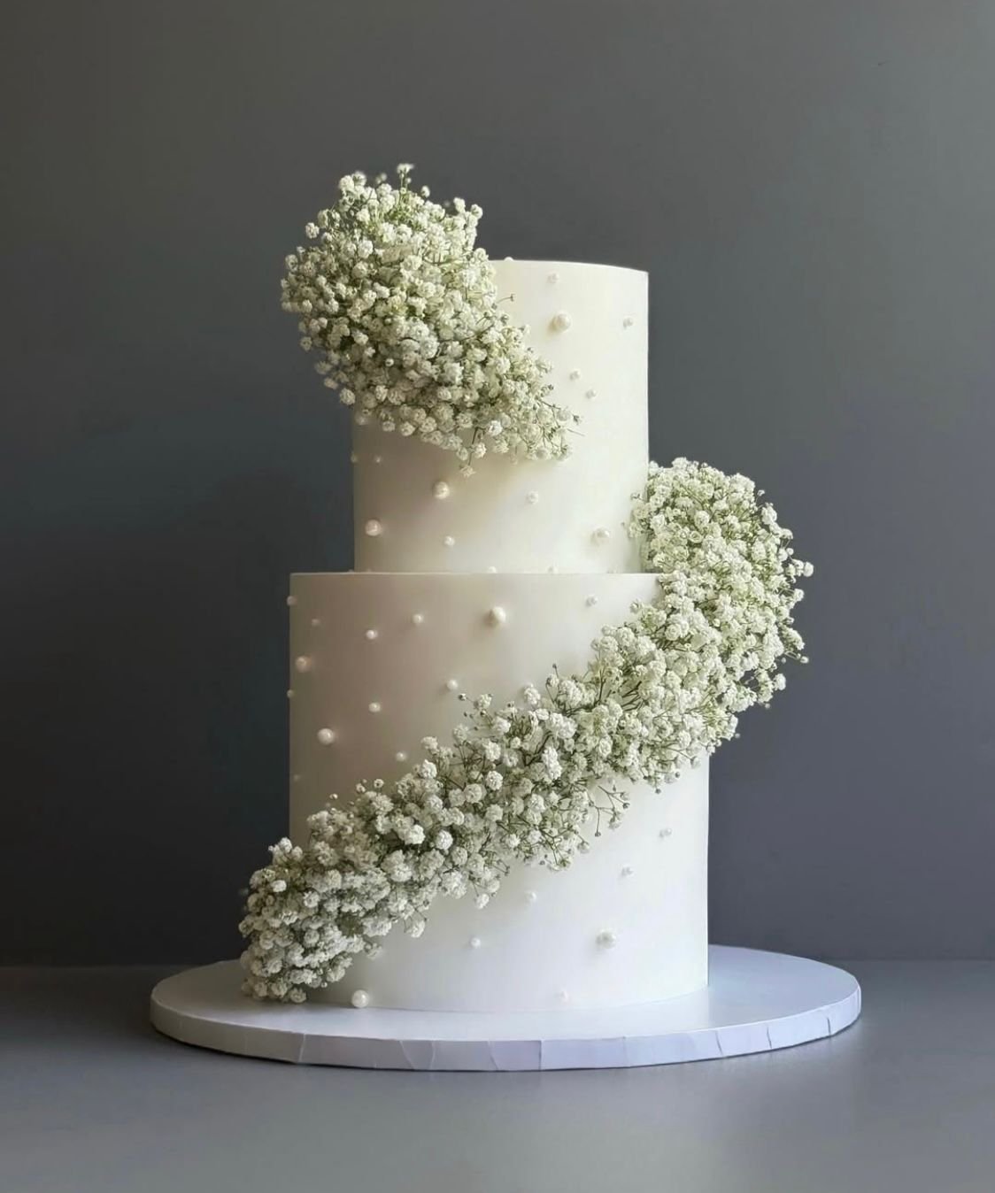 WhatsApp Image 2026-01-22 at 03.42.59 (2) Two-Tier White Cake with Baby’s Breath Flowers 8 pound - Image 1